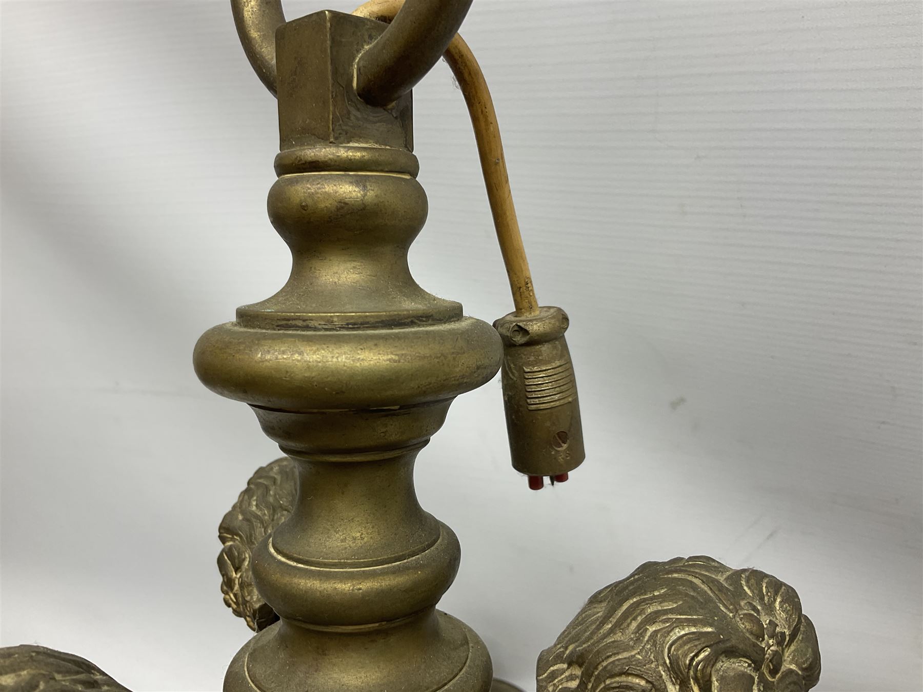 20th century heavy brass eight branch electrolier, detailed with putti masks, approximately H60cm W71cm