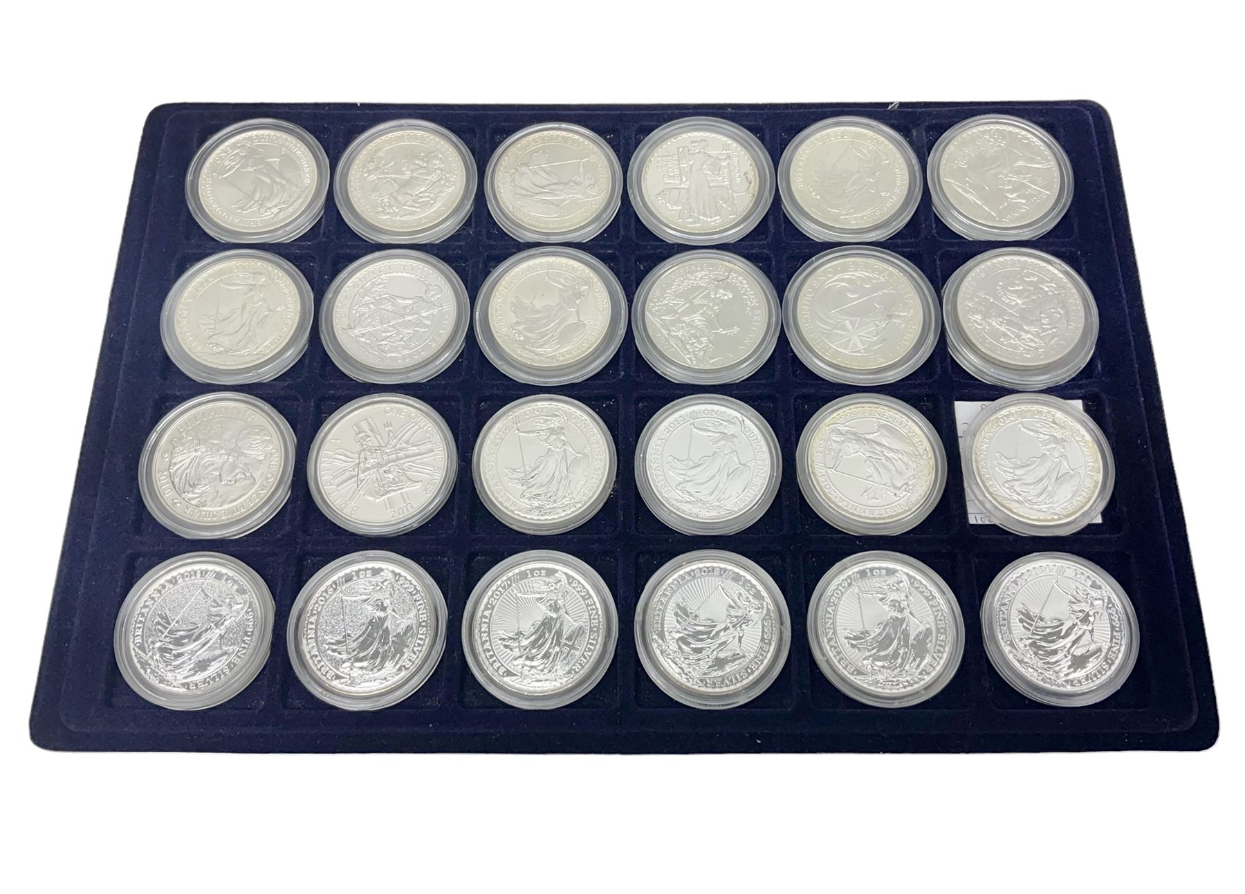 Twenty-four Queen Elizabeth II Britannia one ounce fine silver two pound coins, dated 1998, 1999, 2000, 2001, 2002, 2003, 2004, 2005, 2006, 2007, 2008, 2009, 2010, 2011, 2012, 2013, two 2014, 2015, 2016, 2017, 2018, 2019 and 2020 (24), housed on a coin tray