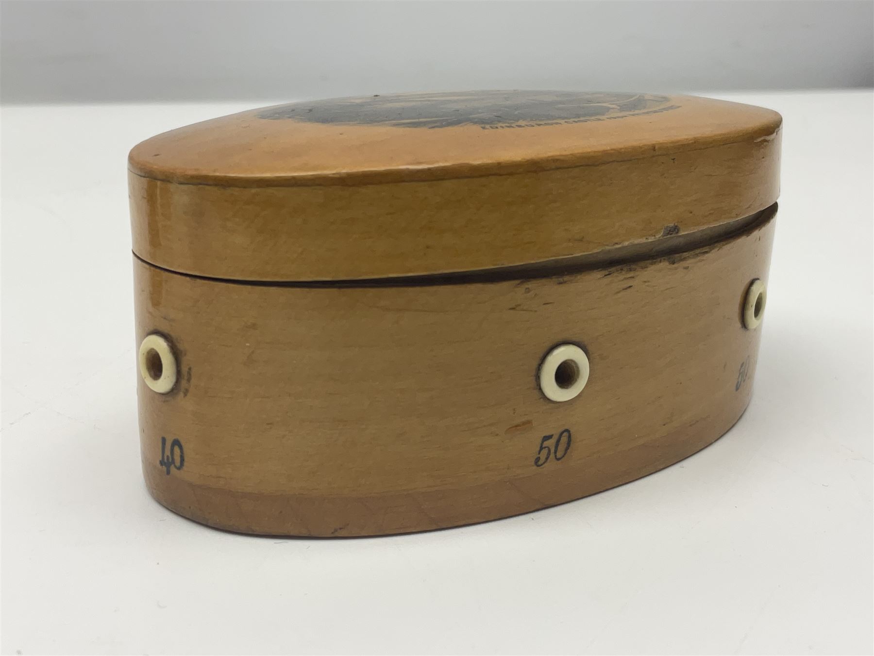 Six sewing related Mauchline ware comprising an oval reel box with internal label for Clark & Co's, tape measure, pin case and three thimble holders of ovoid form 