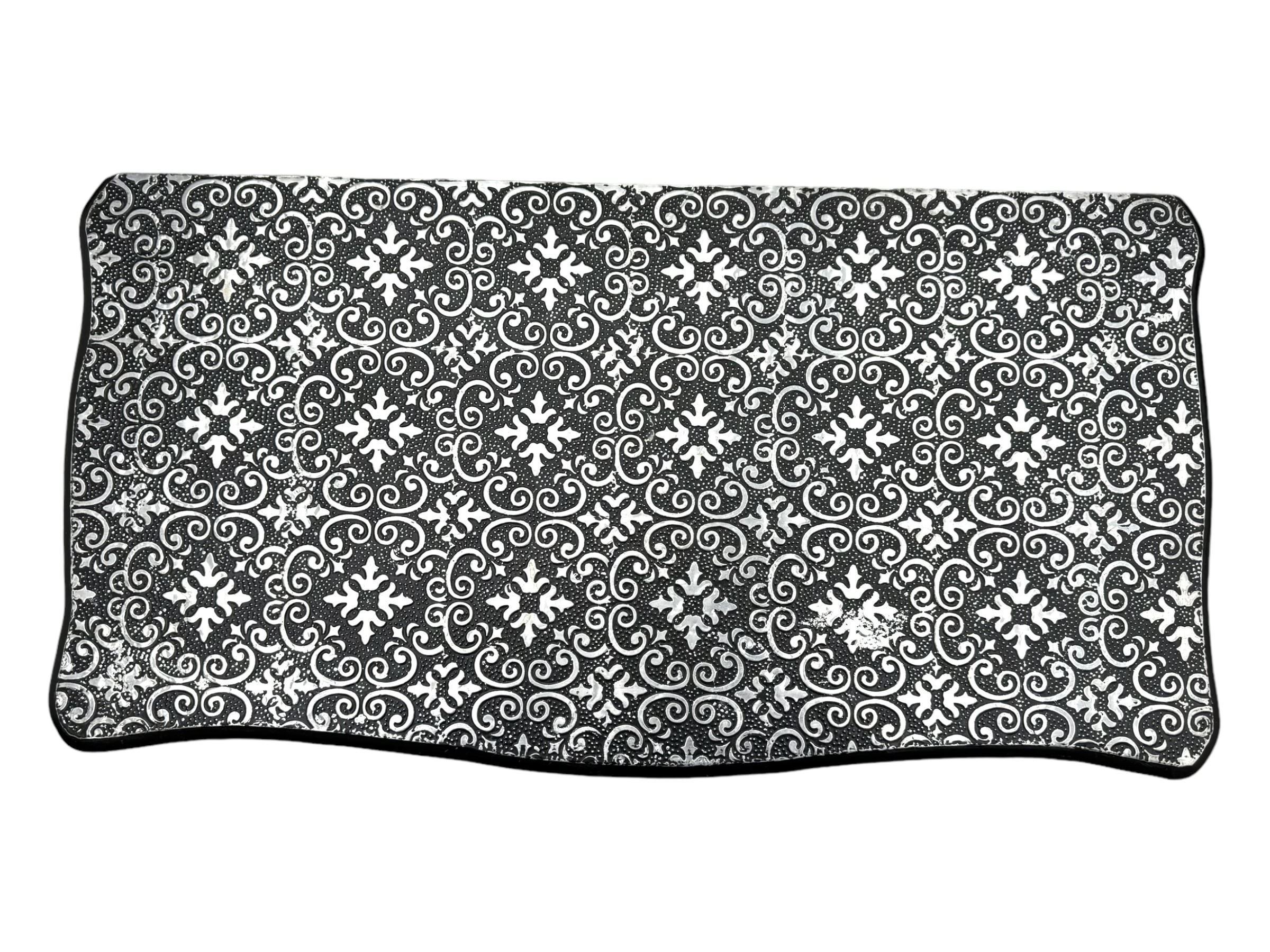 Contemporary black lacquered metal-clad chest, embossed with silver floral scrollwork, shaped rectangular top over three drawers, on cabriole supports (W89cm, D40cm, H79cm); matching two drawer chest (W68cm, D35cm, H67cm)