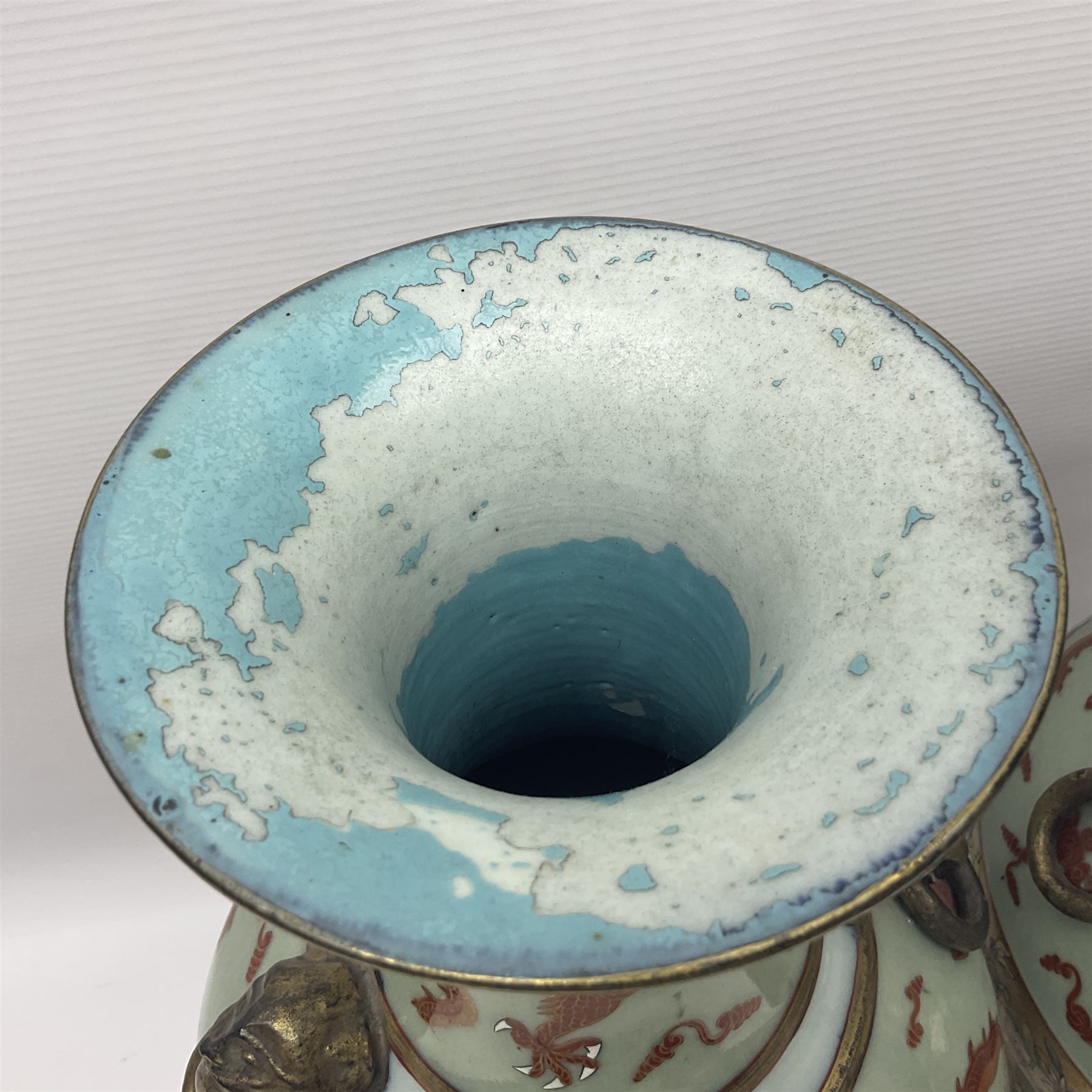 Pair of early 20th century Chinese vases decorated with dragons chasing a flaming pearl, with a gilt border of butterflies and floral sprigs, with Elephant head handles, H44cm 