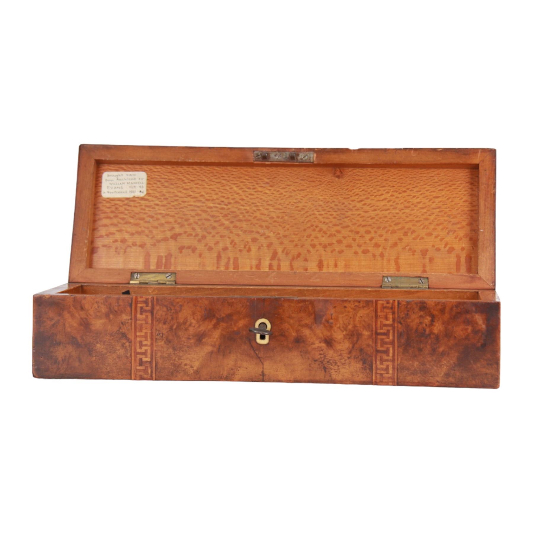 Late 19th century marquetry and parquetry glove box by Anton Seuffert, Auckland, New Zealand, the burr veneer (possibly totara) box of rectangular form, the hinged domed cover detailed with a central shaped cartouche containing a fern, flanked by two cube bands, the interior with paper label detailed 'A. Seuffert Cabinet Maker to His Royal Highness the Duke of Edinburgh Elliot St. Auckland New Zealand', H7.5cm L29cm D10cm, with accompanying key believed to be original 
This item has been registered for sale under Section 10 of the APHA Ivory Act