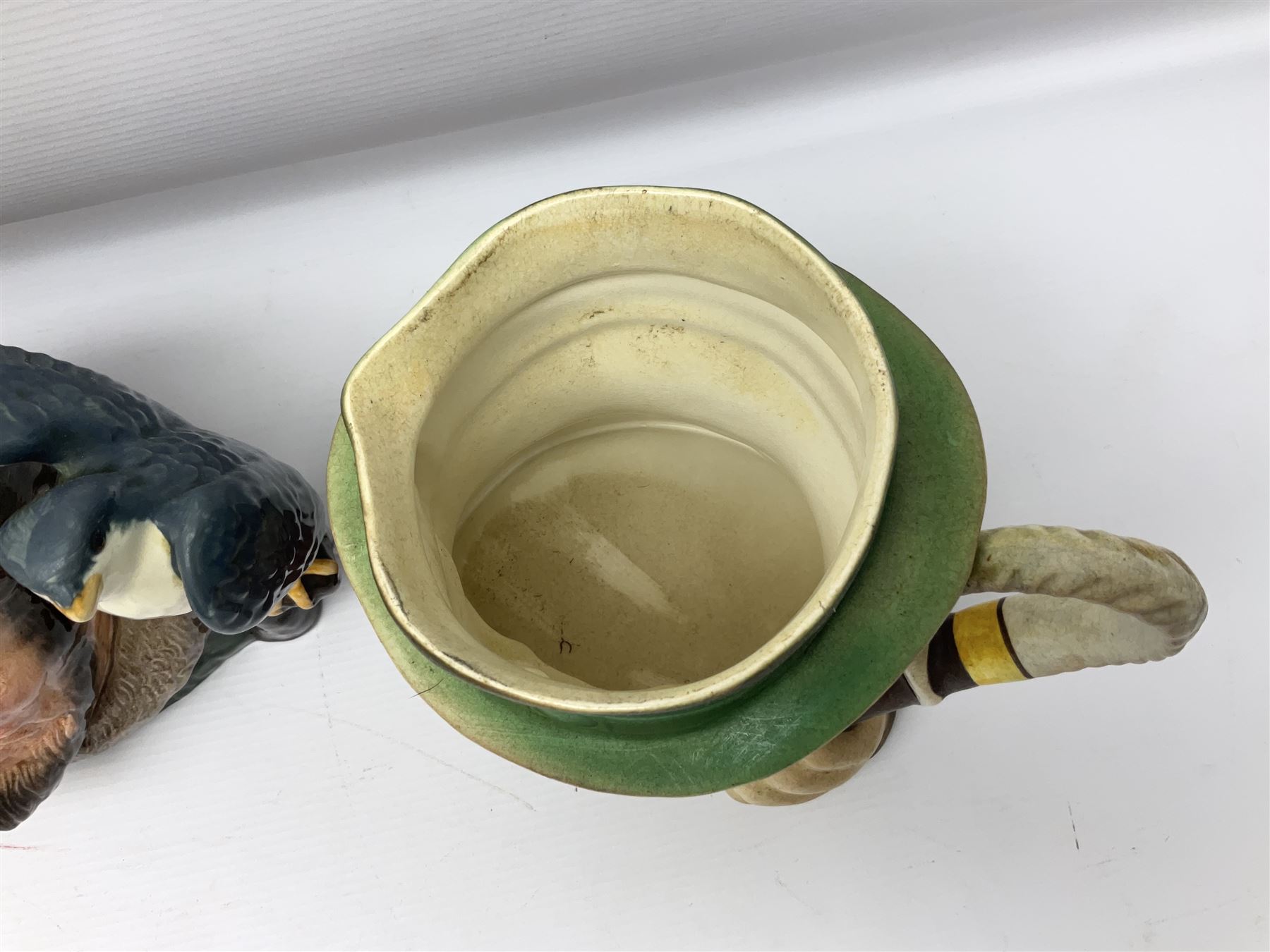 Collection of Royal Doulton and Beswick character jugs of various sizes, including North American Indian D6611, The Falconer D6533,  Tony Weller 281, Sairey Gamp 371 etc