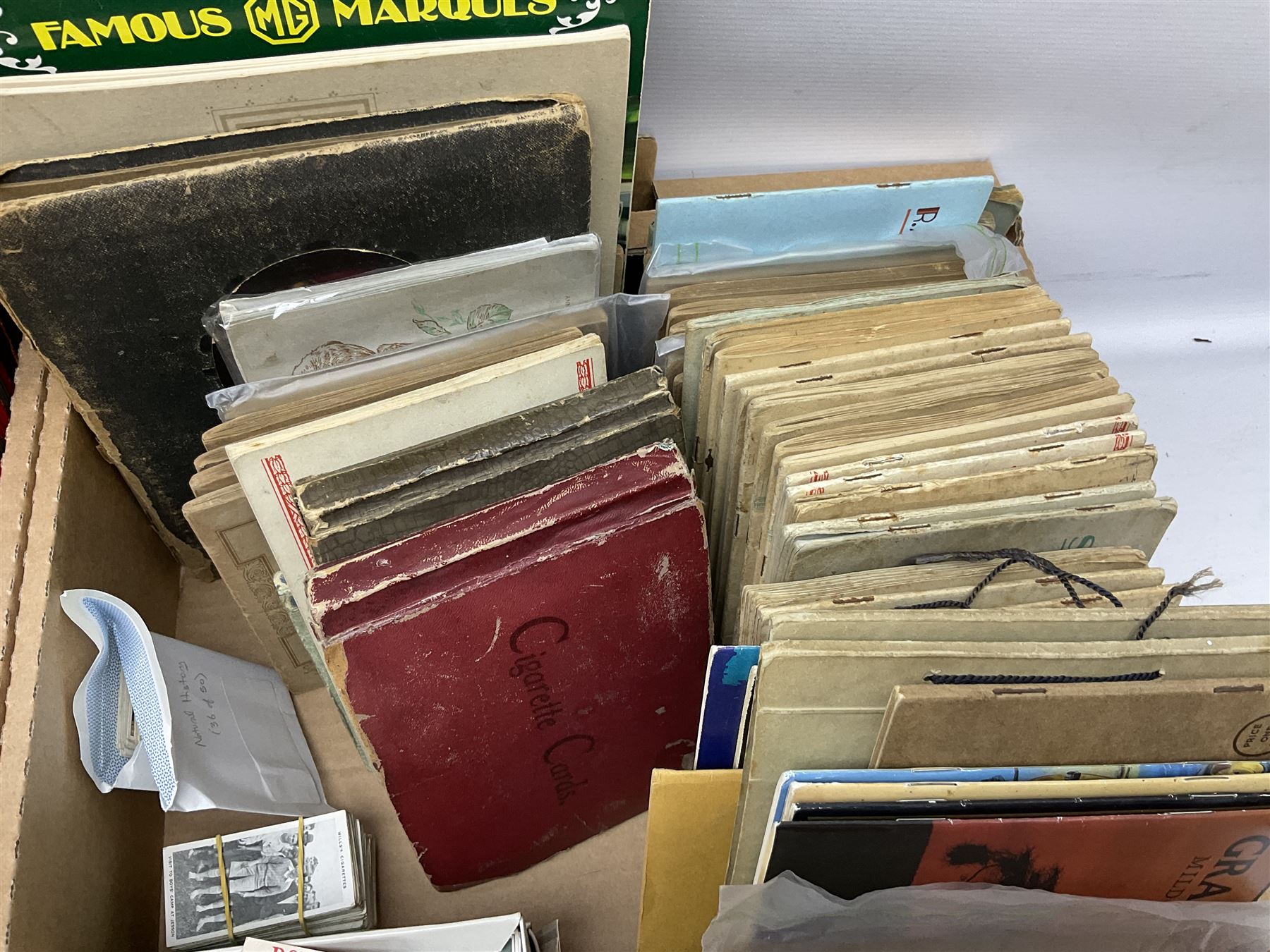 Quantity of cigarette and trade cards, housed in albums and loose, by W.D. & H.O. Wills, John Player & Sons etc, including cycling, garden hints, Britain's railways, dogs etc and various empty vintage cigarette card albums, in two boxes