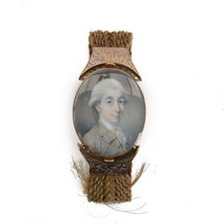 English School (18th century)
Portrait miniature upon ivory
Head and shoulder portrait of Henry Chichester (1724–1799) of Northcote, Devon, and Northover, Somerset, wearing grey coat and white cravat 
Within period gold plated frame, and hairwork strap with foliate engraved gold plated mounts
Oval 3.5cm x 3cm

Provenance: By family descent from the Chichesters of Arlington Court, Devon; from the collection of Andrew Chichester Everitt.

This lot has been registered for sale under Section 10 of the APHA Ivory Act