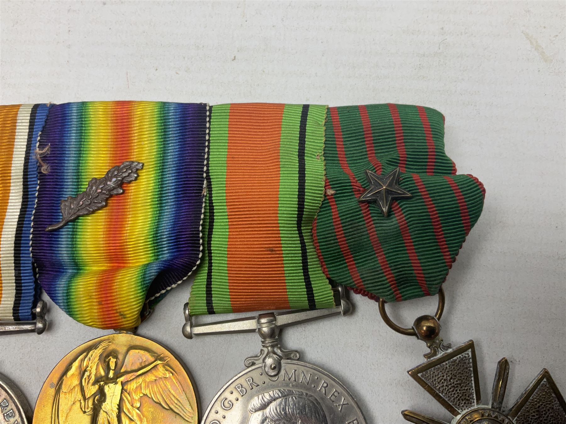 WW1/WW2 Military Cross group of five medals comprising M.C., 1914 Star with date clasp to 34156 Sjt. G. Ferguson R.F.A., British War Medal and Victory Medal with MID leaves to Major G. Ferguson, WW1 French Croix De Guerre with MID Star and WW2 Defence Medal; all with ribbons on pinned wearing bar; WW1 group of five miniature dress medals; two Royal West Kent cap badges; early 20th century silver cigarette case engraved with GF monogram and adapted as a photograph holder with image of Ferguson in civilian clothing; presentation Rotary 9ct gold cased wrist-watch with 1931 British Legion inscription verso; and archive of ephemera including 1914 MID certificate; WW2 Home Guard certificate; over twenty career spanning photographs of Regimental groups, portraits, Sandhurst etc; 1914 Commission document to 2nd Lieutenant; 11th Brigade R.F.A. Roll of Honour 1914-18; 'Soldier's Small Book'; Army Book 439 etc