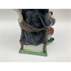 Early 20th century Staffordshire William Kent Squire toby jug, modelled seated upon a corner chair holding a jug of ale in his right hand, H28cm