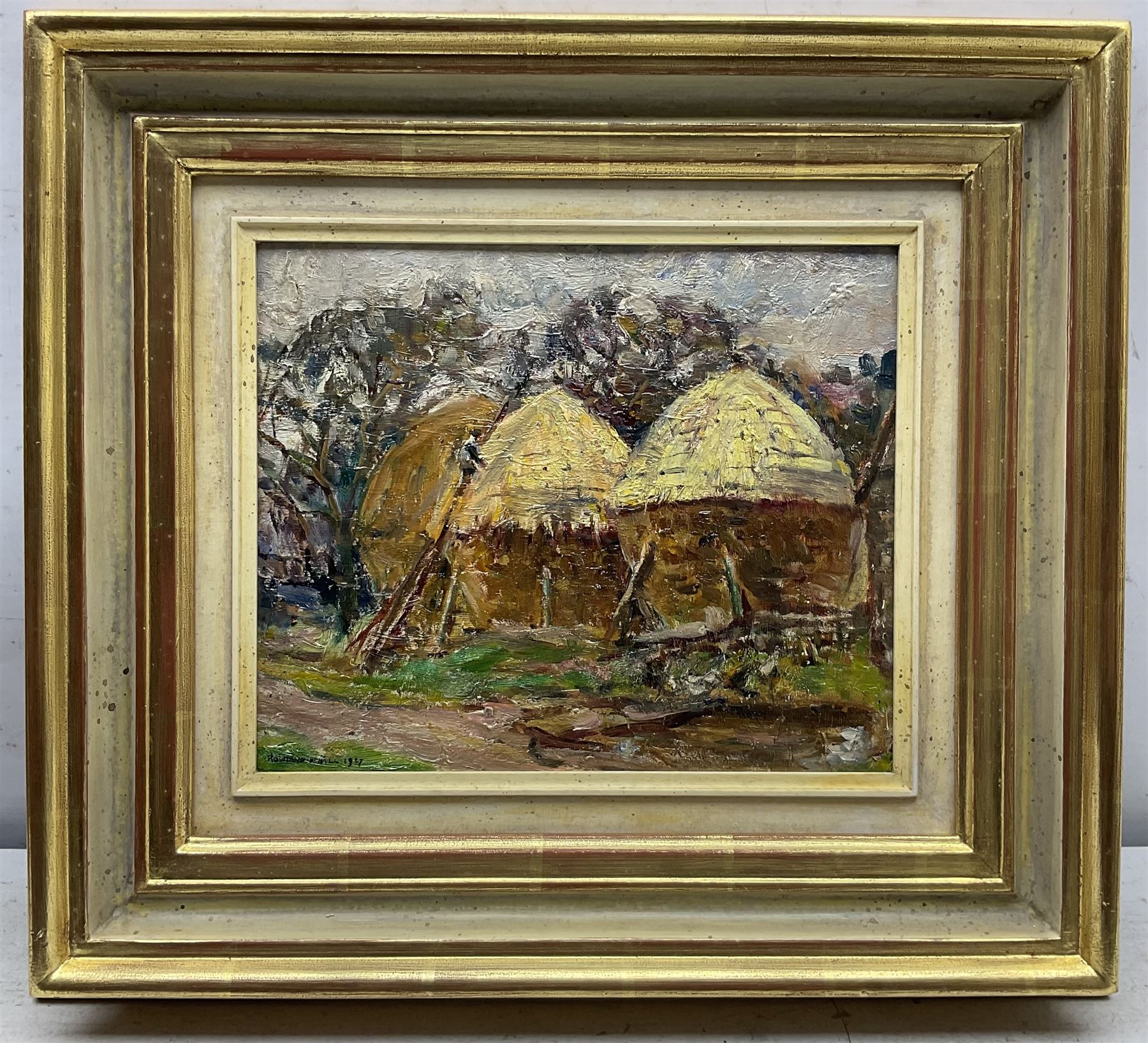 Rowland Henry Hill (Staithes Group 1873-1952): 'Cornstacks at Ellerby', oil on board signed and dated 1927, 22cm x 27cm 
Provenance: private collection, exh. Phillips & Sons, The Dower House, Cookham, June 1976 and September 1987, label verso