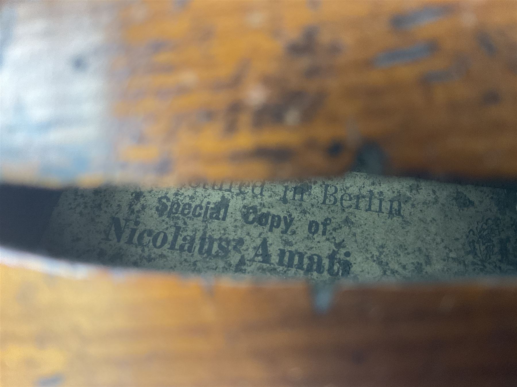 Late 19th century German trade violin c1890 with 36cm two-piece birds-eye maple back, neck and ribs and spruce top; bears label 'Manufactured in Berlin Special Copy of Nicolaus Amati' L59.5cm; in carrying case