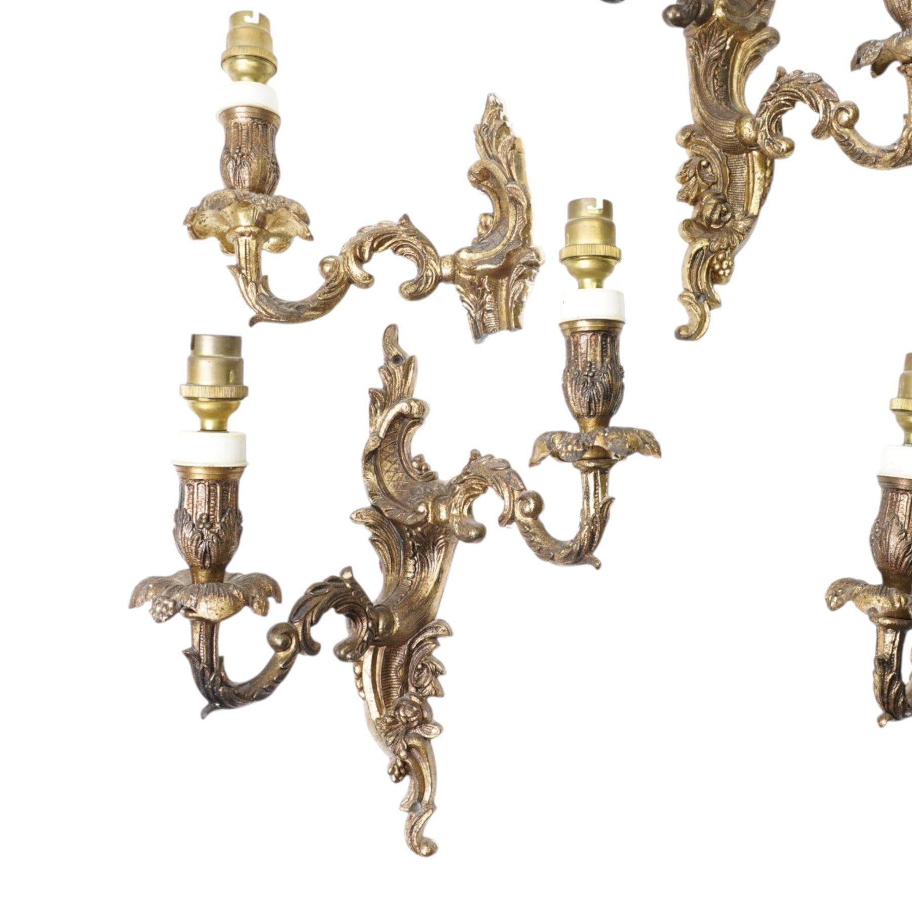 Three brass two branch wall lights and  a pair of single wall lights