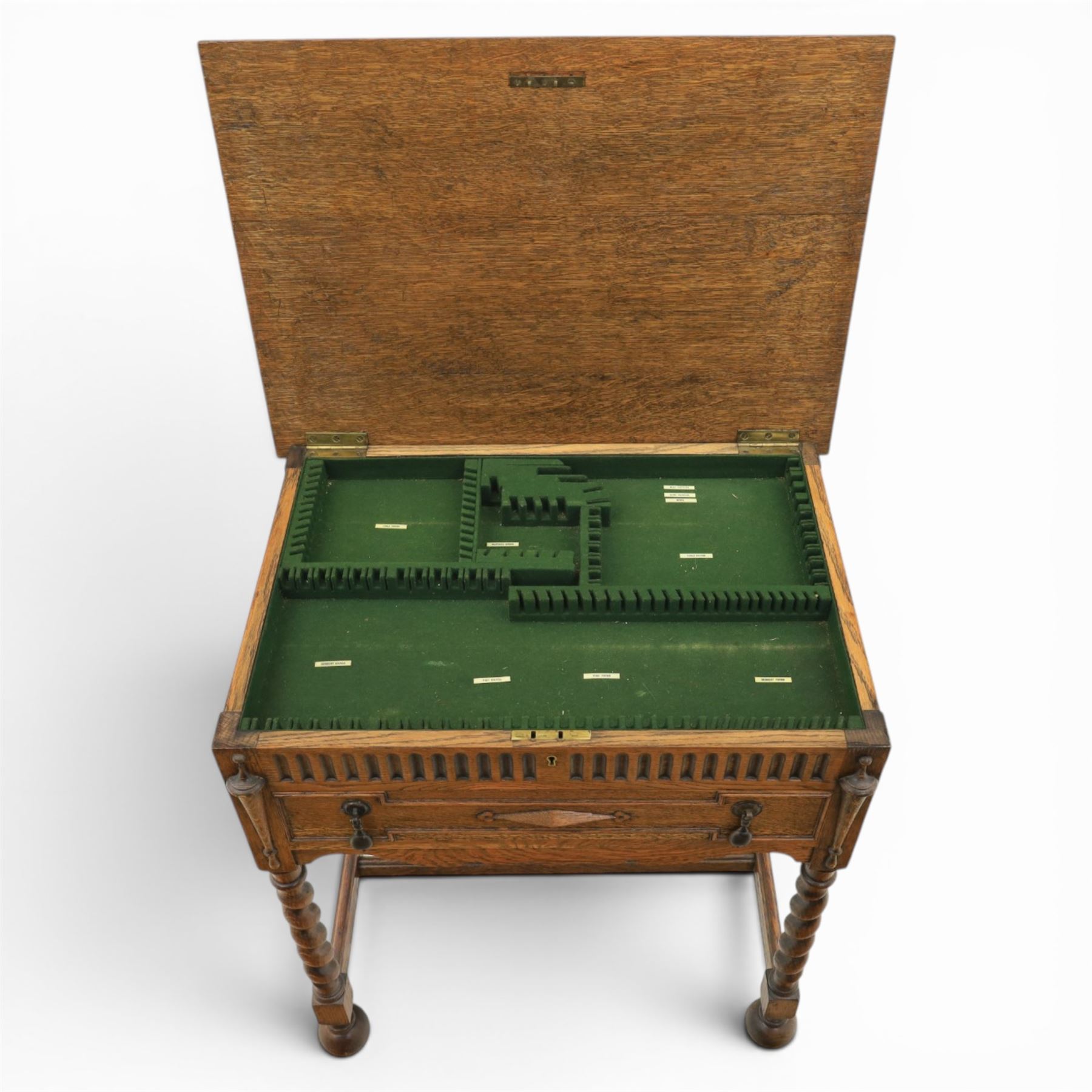 Early 20th century oak cased canteen on barleytwist stand, hinged top with fitted baized lined interior, above a drawer fitted for cutlery