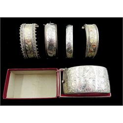 Two 19th/early 20th century silver bangles with two tone foliate bright cut decoration, one stamped Standard, the other sterling silver, silver bangle by Charles Horner, Chester 1958 and two other silver bangles with foliate decoration, hallmarked