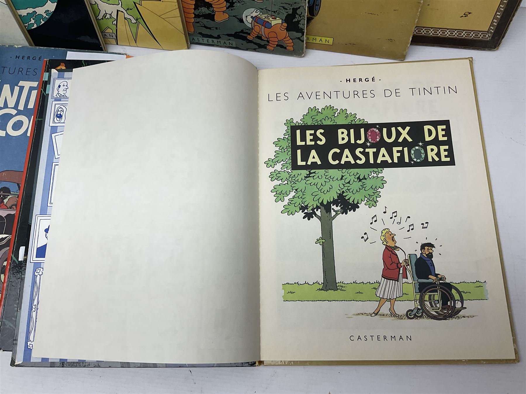 Twenty one first edition Herge, 'The Adventures of Tin Tin' books published by Casterman Bruxelles, with French text and coloured comic strip illustrations throughout; comprising Tintin Au Congo 1946, Tintin En Amerique 1946, Les Cigares du Pharaon 1955, Le Lotus Bleu 1946, L'Oreille Cassee 1943, L'ile Noire 1943, Le Sceptre d O'ttokar 1947, Le Crabe Aux Pinces D'or 1943, L'Etoile Mysterieuse 1942, Le Secret de la Licorne 1943, Le Tresors de Rackan Le Rouge 1945, Les 7 Boules de Cristal 1948, Le Temple du Soleil 1949, Au Pays de L'Or Noir 1950, Objectif Lune 1953, On a Marche sur la Lune 1954, L'Affaire Tournesol 1956, Coke en Stock 1958, Tintin au Tibet 1960, Les Bijous de la Castafiore 1963 and Vol 714 Pour Sydney 1968
