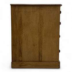 Late 19th-century Victorian stripped pine twin pedestal kneehole dressing table, the rectangular top above three short and three graduated drawers on each pedestal and a central cupboard, on a moulded plinth base 