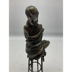 Art Deco style bronze modelled as a female figure seated upon a chair holding an apple, after 'Pierre Collinet', H28cm