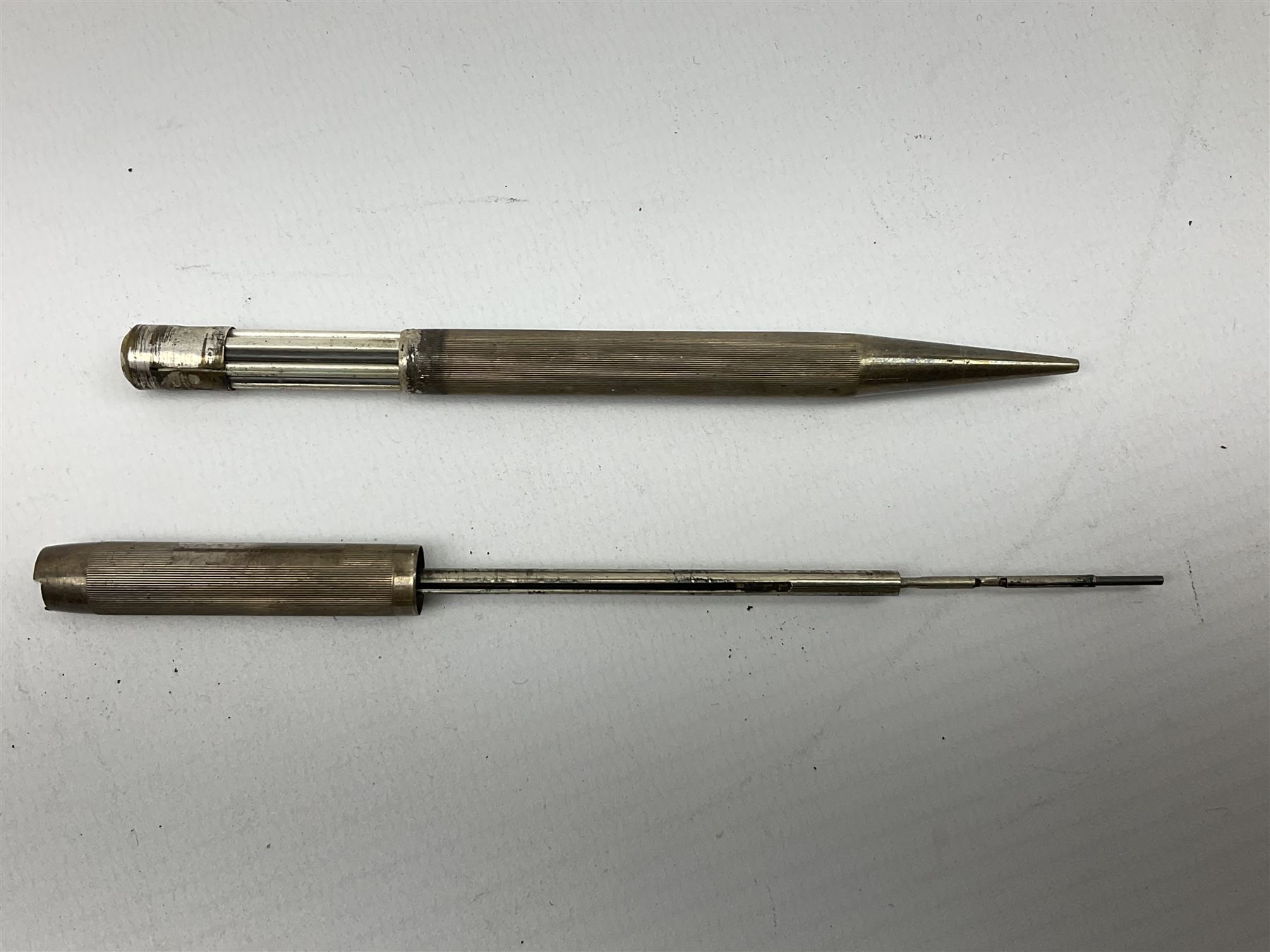 20th century engine turned silver propelling pencil by Johnson, Matthey & Co, stamped London 1956, together with silver cigarette case stamped Birmingham 1904 with engraved foliate decoration, total weight 74g