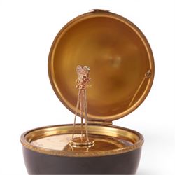 Limoges Fabergé  'Movie Camera' egg, the black and gilt hinged lid opening to reveal a gilt interior with a film camera to the center, with certificate and box, H14cm