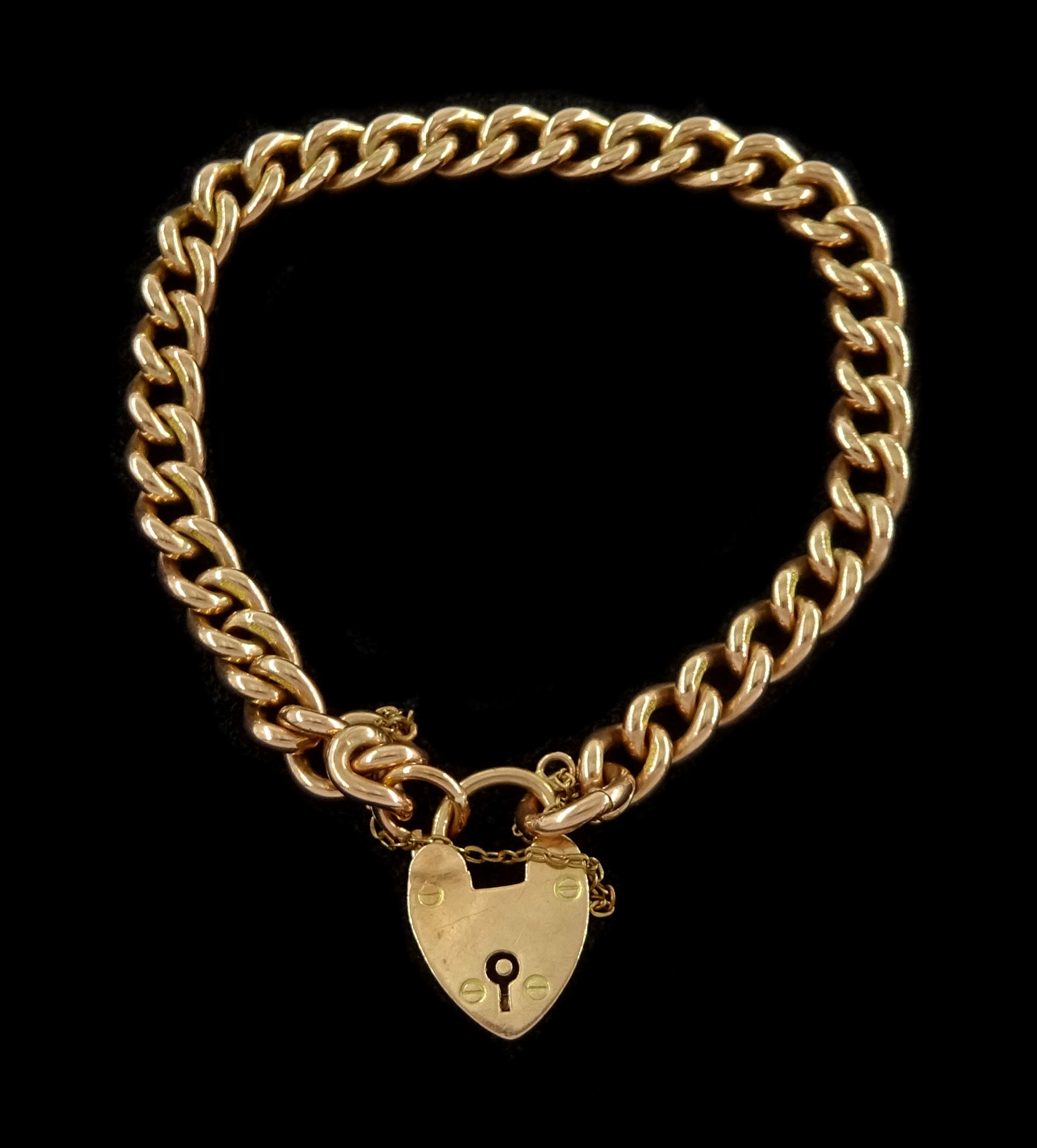 Early 20th century 9ct rose gold curb link bracelet, London 1929, with rose gold heart locket clasp stamped 9c