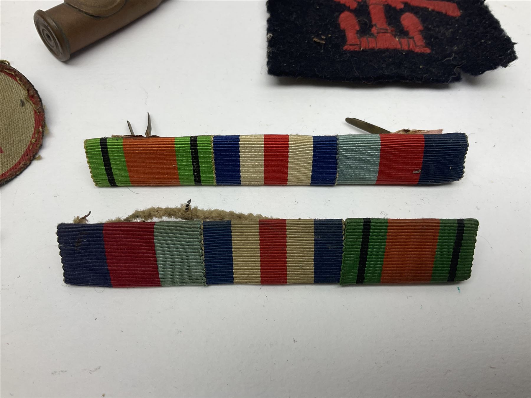 WW1 Short & Mason Ltd 'The Magnapole' black japanned brass field compass in leather carrying case; WW1 trench art paper knife inscribed Dixmude; and small quantity of cloth badges etc