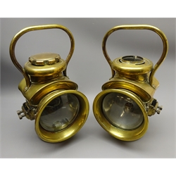  Pair of Powell & Hamner brass oil Motor Sidelamps, the drum bodies with side brackets, resevoir base, top handle and 12cm clear convex lens, stamped on base, H34cm (2)   