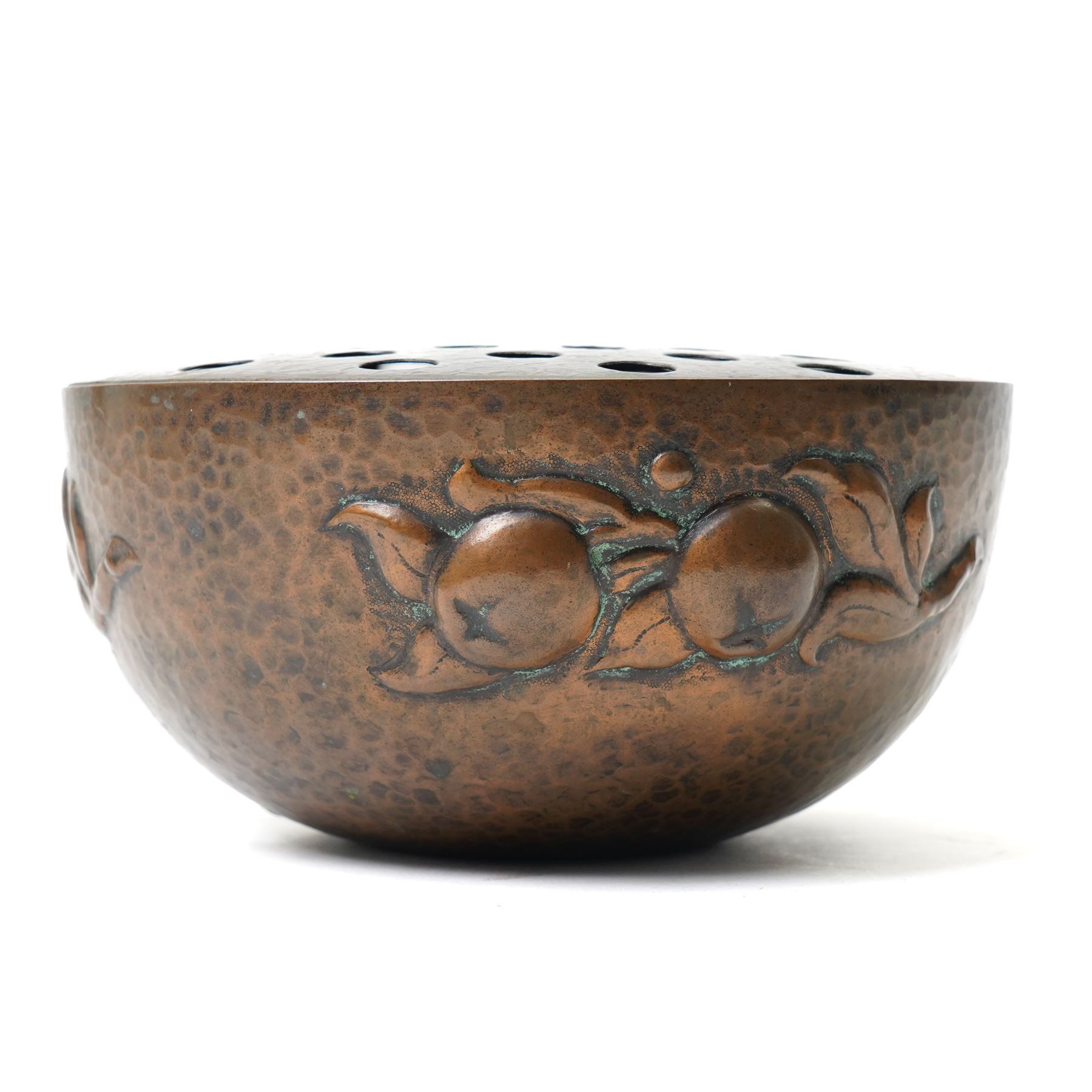Newlyn school Arts and Crafts copper rose bowl, the planished exterior with fruit and leaves in high relief, H8.5cm x W18cm