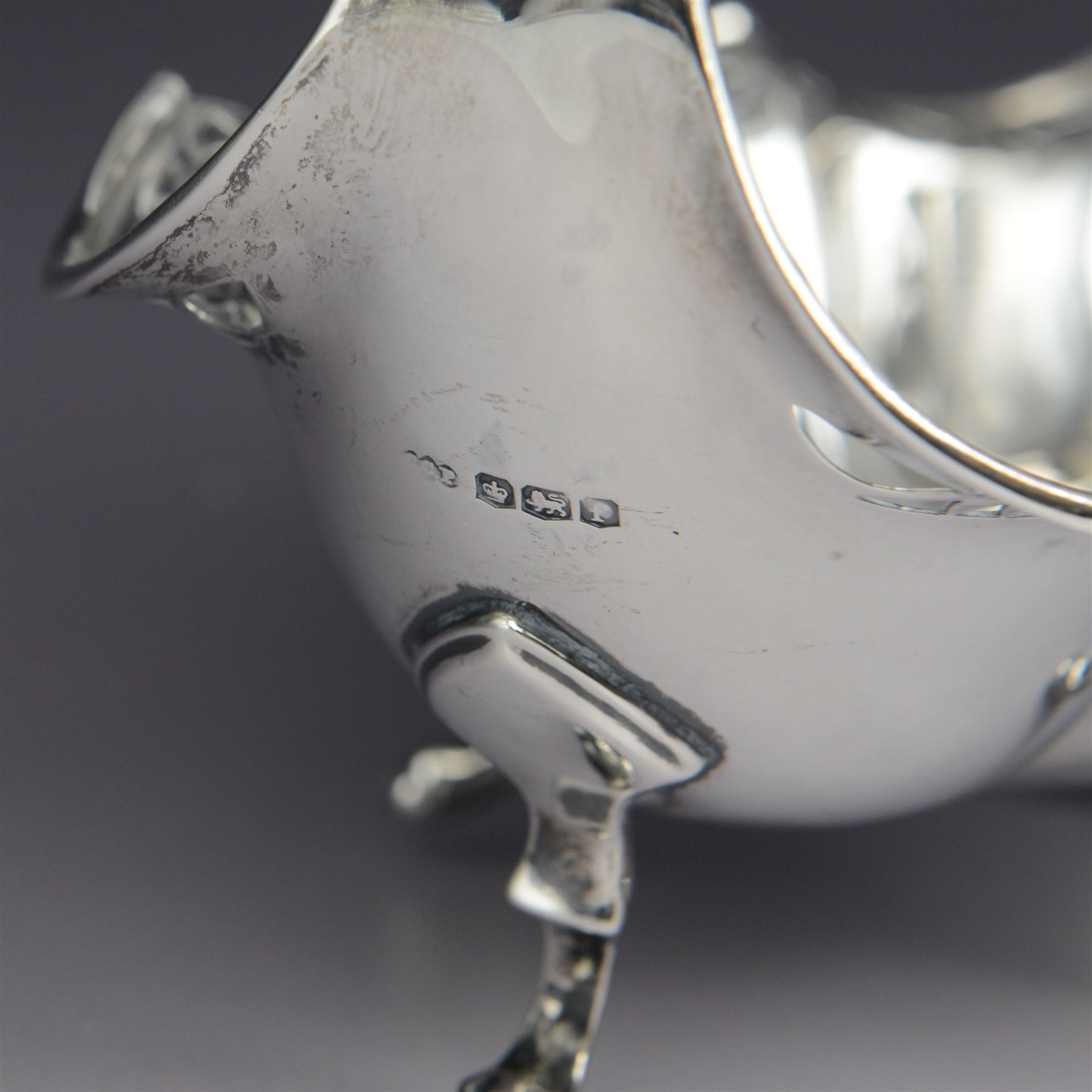 1920s silver basket, of navette form with pierced rim and lobed bowl, with fined pierced handle and upon four paw feet, hallmarked Sibray, Hall & Co Ltd, Sheffield 1923, including handle H18.5cm