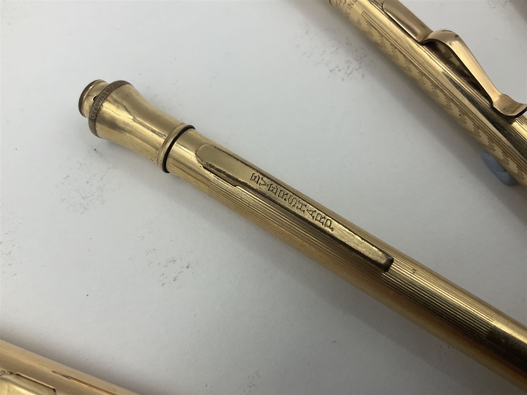 Five gold filled Wahl Eversharp propelling pencils, together with a silver propelling pencil, hallmarked London 1946, J.M.Co Johnson, Matthey & Co, and two further gold filled propelling pencils, one with box, largest L13cm (8)