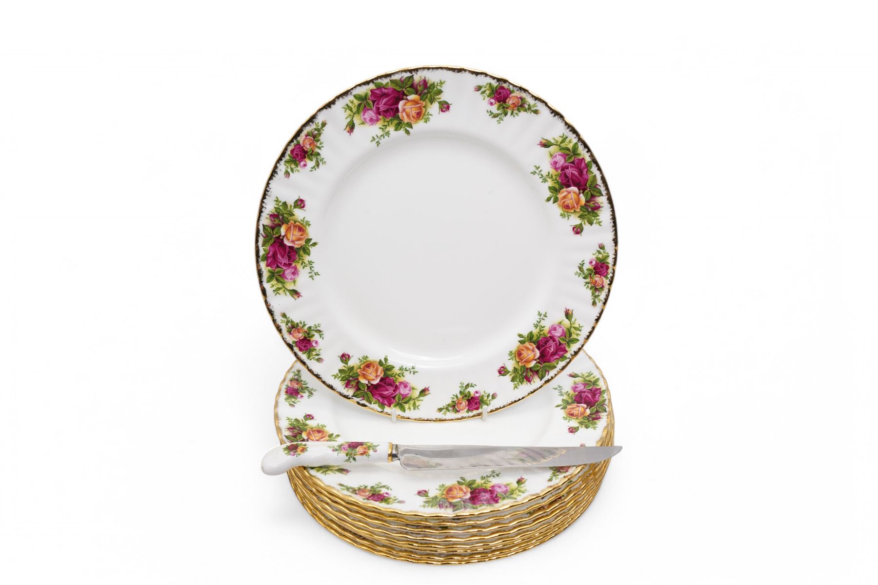  Royal Albert Old Country Roses tea and dinner service comprising nine dinner plates, nine dessert plates, nine cups, eight saucers, milk jug, salt and pepper, bread knife and two saucer dishes