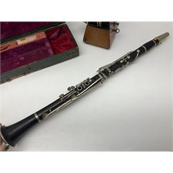 Early 20th century Hawkes and Son simple system hardwood clarinet serial no.1HM257102; cased; and a Swiss Maelzel BS Dulcet metronome of typical pyramid form (2)