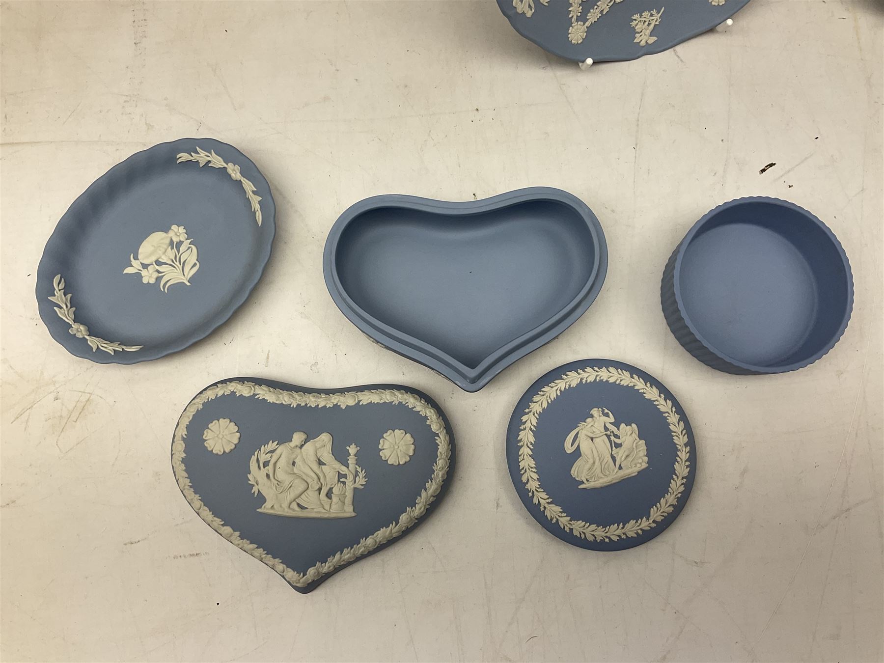 Wedgwood pale blue Jasperware, to include a pair of tulip vases, large vase with fluted rim, trinket dishes, trinket box etc, together with Wedgwood miniature hanging decoration in the form of a tea set 