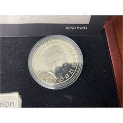 Danbury Mint 'The Ultimate James Bond Collection' comprising stamps and coins housed in a display case, 'Concorde Queen of the Skies' sculpture, stamps, medallion display and 2020 'Centenary of the Unknown Warrior' five pound coin cover in Harrington and Byrne folder