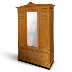 Victorian waxed pine wardrobe, carved projecting cornice with mirrored door, enclosing clo...