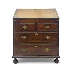 George III oak bureau, sloped fall-front enclosing a fitted interior with pigeonholes, small drawers, and a central compartment, over two short and two long drawers, brass escutcheons and drop handles, raised on bun feet