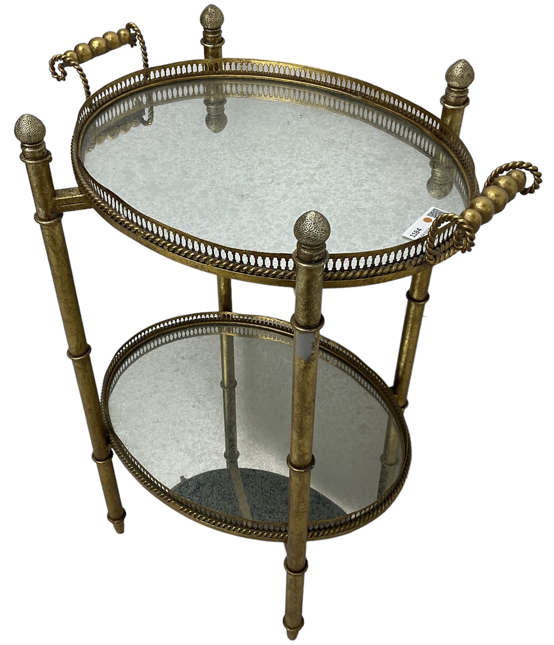 Gilt metal oval stand, two mirrored tray tiers with raised pierced galleries