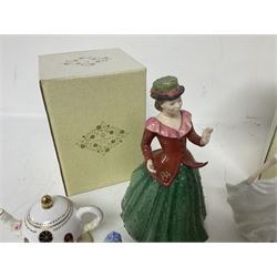 Two Coalport cottages, comprising Teapot cottage and Easter Cottage, together with four Royal Doulton figures, including Holly and Friendship 