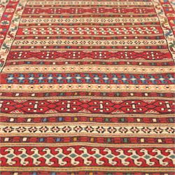 North East Persian Sumak flatweave kilim runner, elongated field decorated with horizontal bands of stylized geometric motifs in madder red, ivory, indigo green, and ochre enclosed by bold geometric borders  