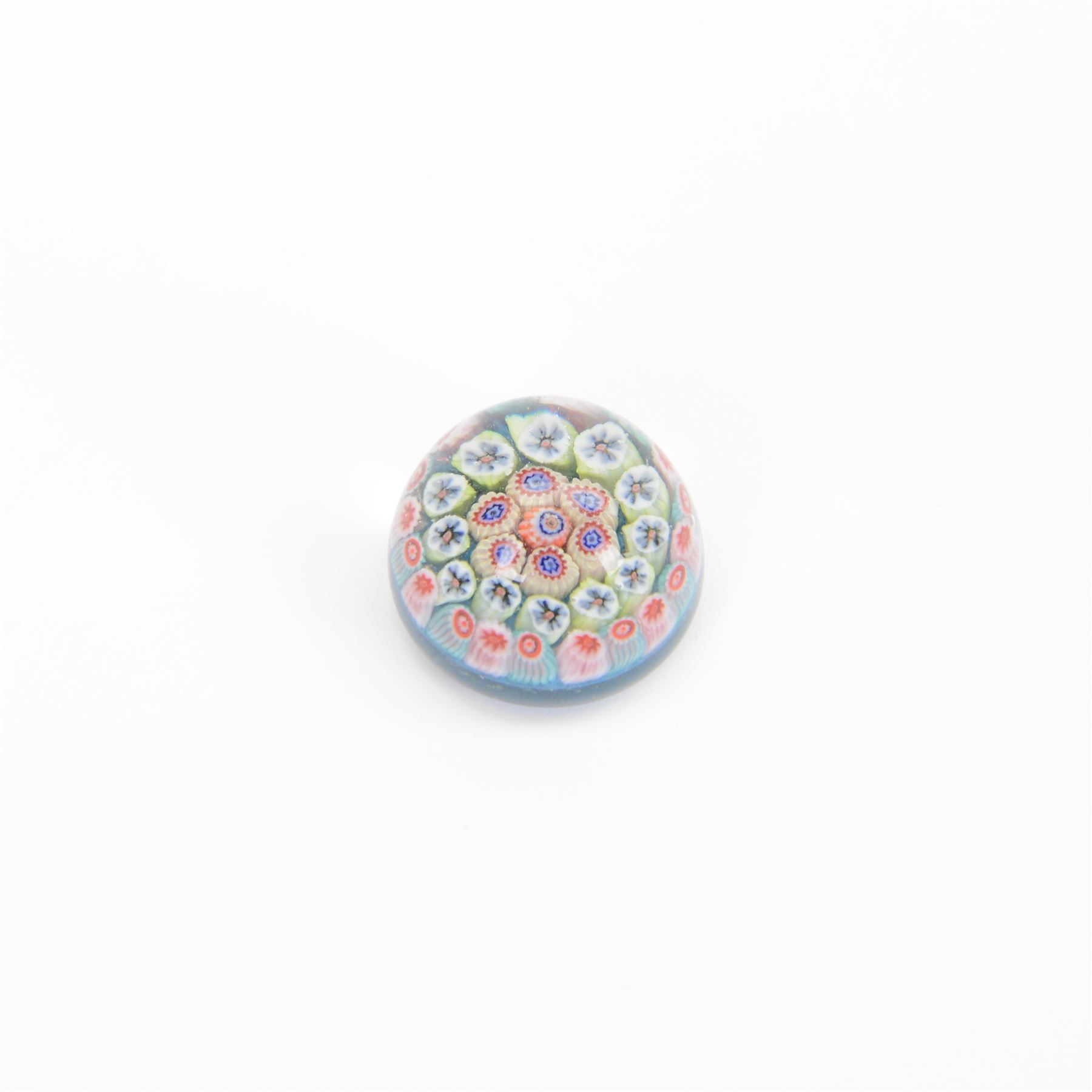 Nine miniature milleifiori paperweights including an example with twisted canes 
