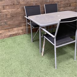 Rectangular metal framed garden table with glass top and four stackable chairs - THIS LOT IS TO BE COLLECTED BY APPOINTMENT FROM DUGGLEBY STORAGE, GREAT HILL, EASTFIELD, SCARBOROUGH, YO11 3TX