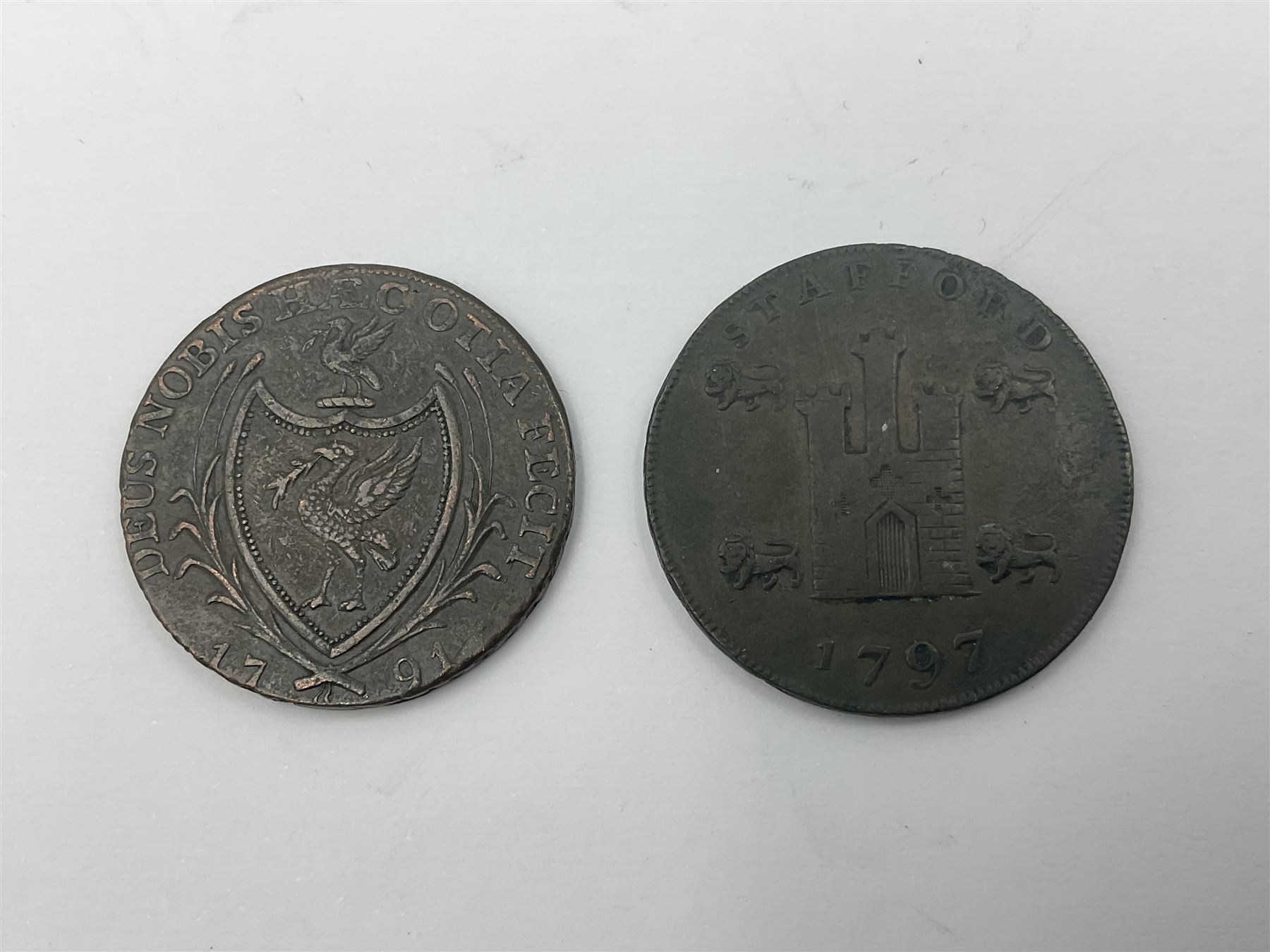 Four Georgian tokens comprising 1791 Liverpool Thomas Clarke Halfpenny, two 1795 Bakers Halfpennies and 1797 Stafford Halfpenny 
