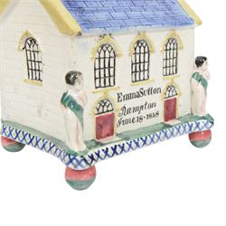 Mexborough Prattware Wesleyan Chapel Money Box, 1848, typically modelled as a chapel with putti to the front corners, on ball feet, inscribed  to the front Emma Sutton Bampton June 18 1848, H17cm, L15cm