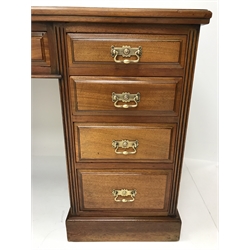  Later Victorian golden walnut twin pedestal desk, nine mahogany lined drawers with original brass handles stamped '1887', plinth base, W129cm, H78cm, D57cm  