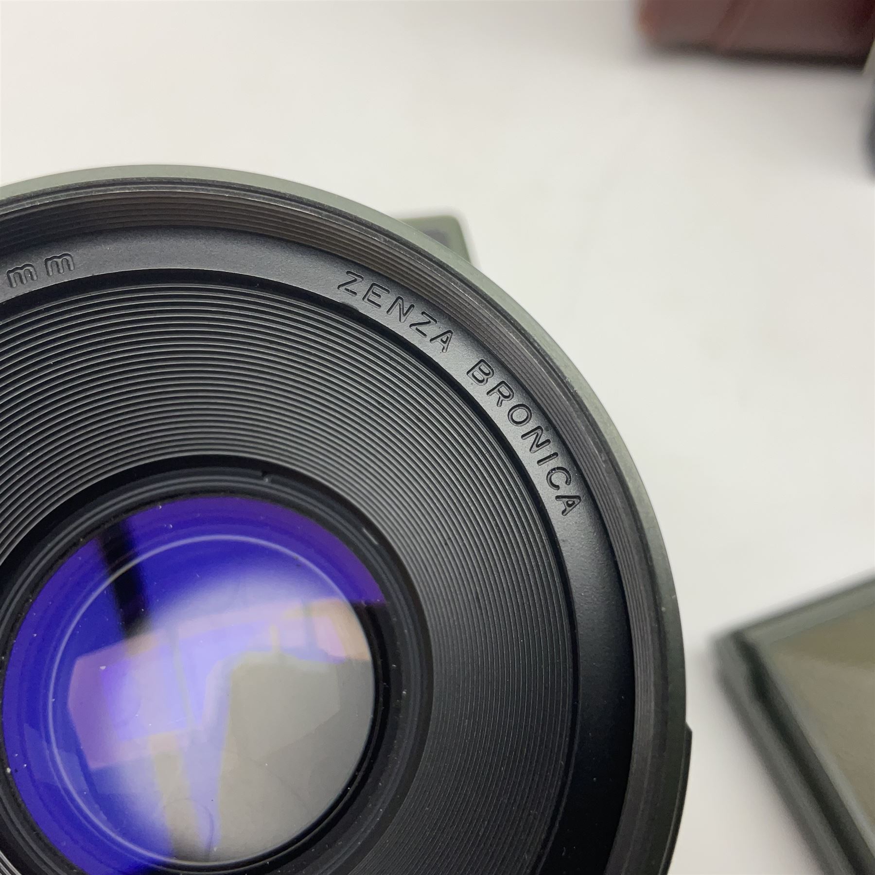 Zenza Bronica ETRS camera body, safari edition, serial no. 7100811, with 'Zenza Bronica Zenzanon EII 1:2.8 f=75mm' lens, serial no. 7908591, film magazine back, safari, serial no. 8100564, AE-ii metering head, safari, serial no. 617024, etc, all in leather case