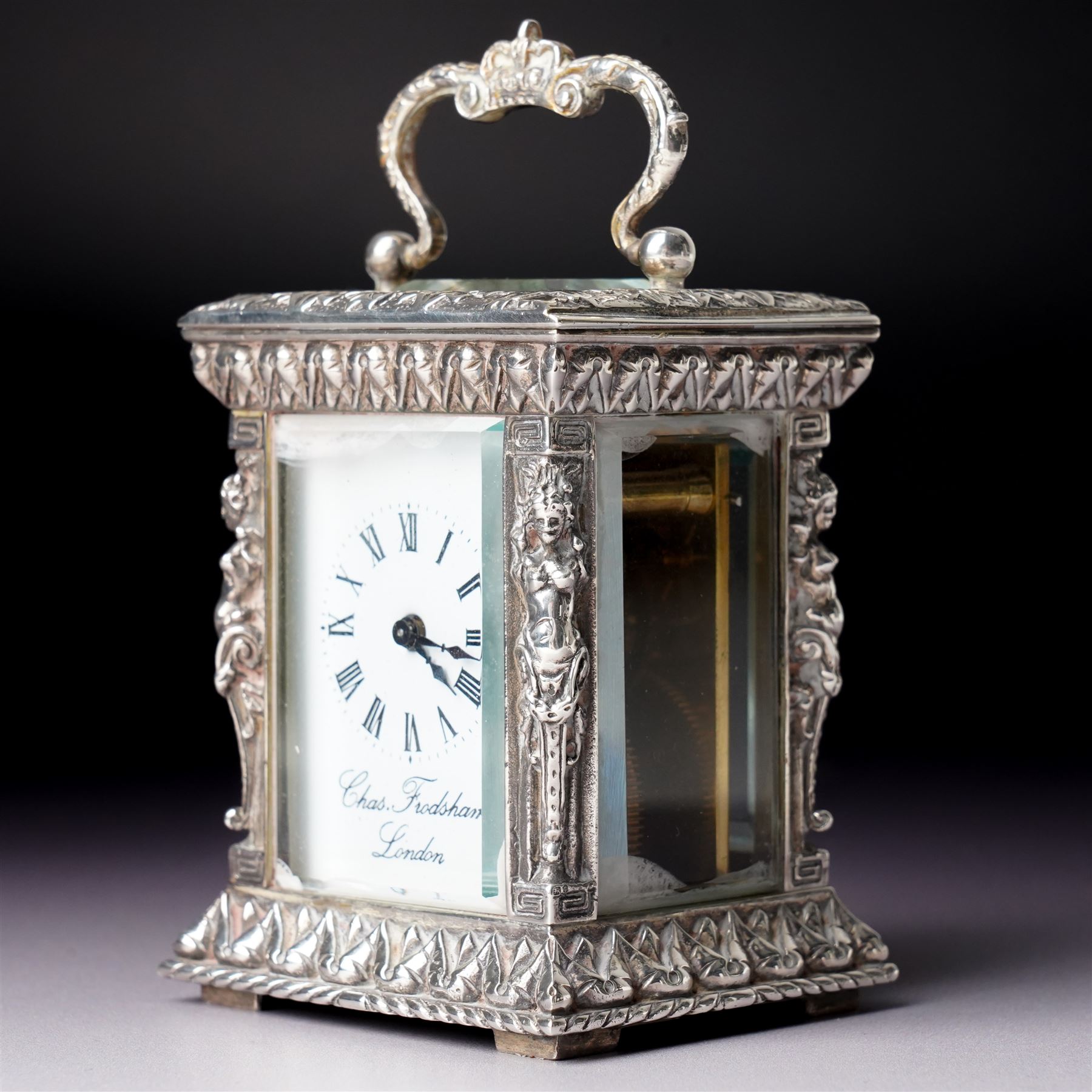 Chas Frodsham -  Miniature carriage clock with white dial and platform lever escapement in cast silver case with caryatid columns and bevelled glass panels H10cm  London assay No.0468