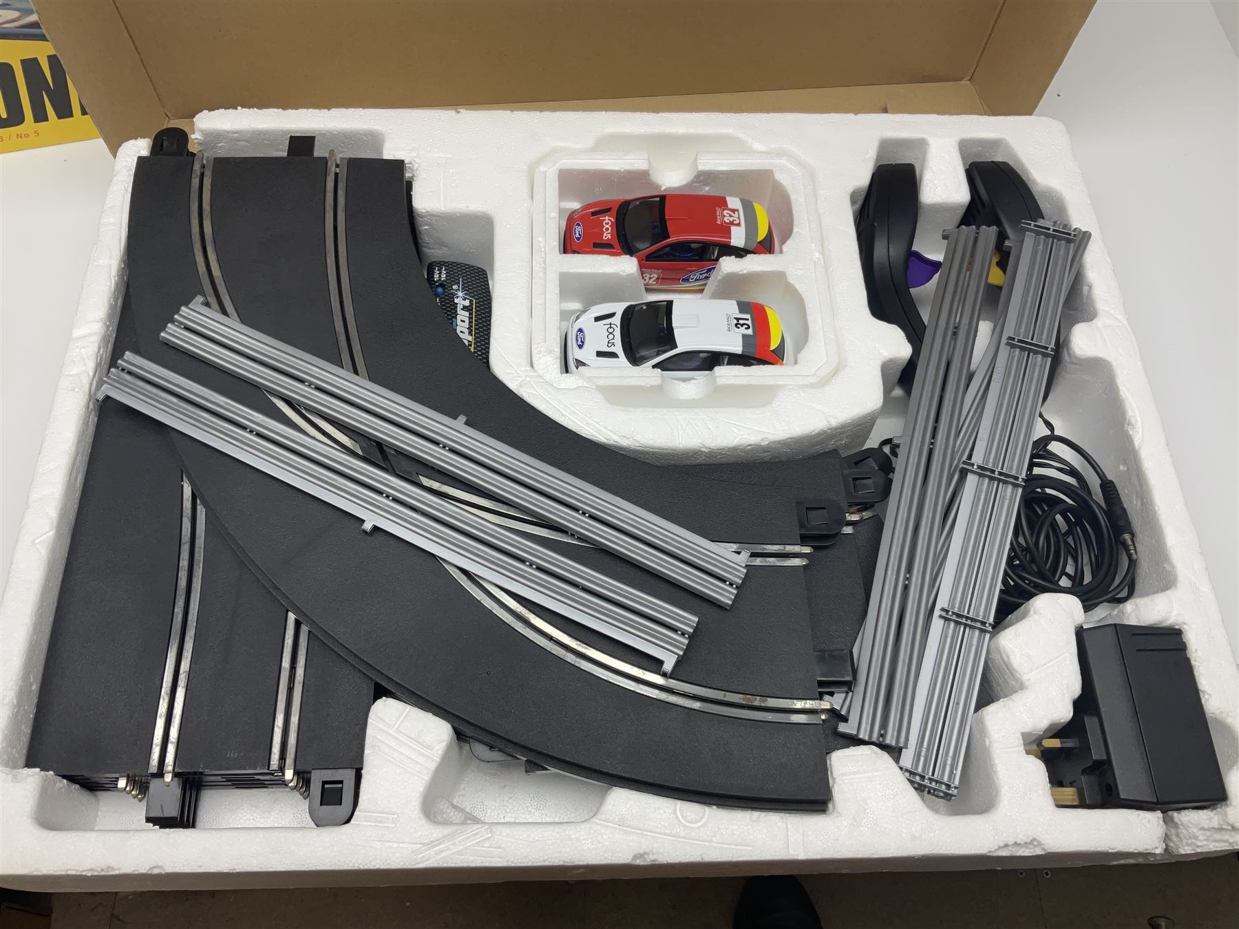 Scalextric - Formula One set with McLaren Mercedes and Williams BMW cars; and Speed Extreme set with Ford Focus cars; both boxed with accessories and paperwork; and Parker Pro-Action football game; boxed (3)