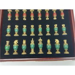 Franklin Mint House of Faberge 'The Imperial Jewelled Chess Set', to include set of chess pieces with malachite finish and a set with carnelian finish and a hardwood chess board