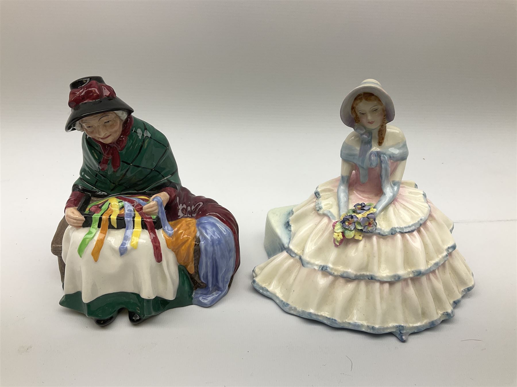 Group of figures, comprising six Royal Doulton examples, Daydreams HN1731, Silks and Ribbons HN2017, Tom Sawyer HN2926, Marie HN1370, Bo-Peep HN1811, and Tinkle Bell HN1677, together with a Dresden type 'lace' example, and a Coalport 'Swiss Cottage', (8)