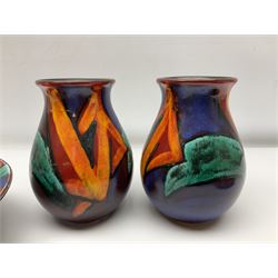 Four pieces of Poole Pottery in Graffiti pattern, comprising pair of vases of baluster form, dish and small plate, with impressed or printed marks beneath, vase H17cm