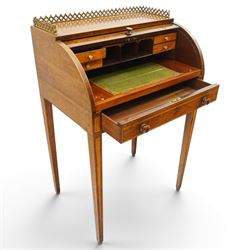 Regency period inlaid mahogany Ladies cylinder writing desk, the rectangular satinwood banded top with raised pierced brass three-quarter gallery, over a cylindrical roll-top enclosing a satinwood fitted interior with pigeonholes, correspondence drawers, ink wells and a sliding hinged writing slope, the base fitted with single frieze drawer, raised on square tapering supports
Provenance: Kirkham Hall