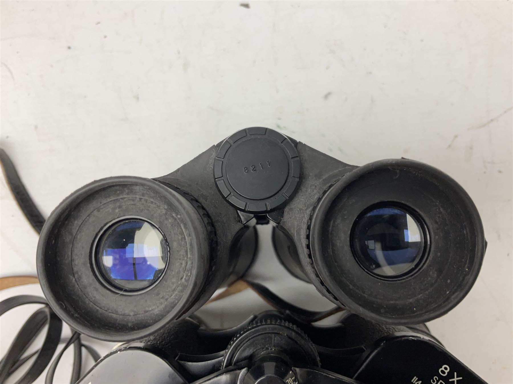 Eleven cased pairs of binoculars to include Summit 8x30,  Concord 8x40, Tasco no. 106 8x - 16x40, Chinon 10x50, Tokina 7x42 Field, Zoom 6x- 12x32 etc