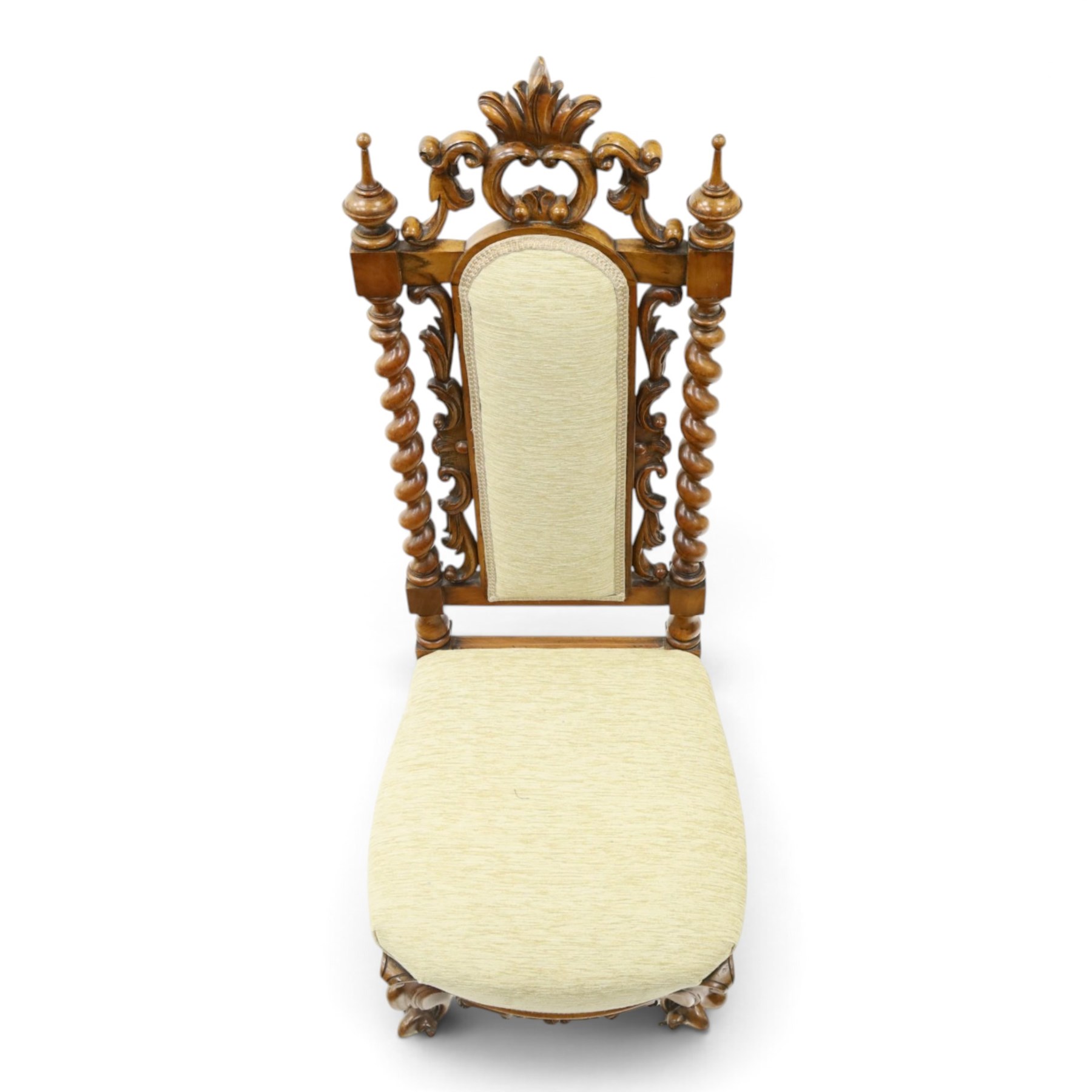 Victorian carved walnut side chair, the ornate high back with pierced and carved scrolled cartouche cresting rail, the back panel and sprung seat upholstered in sage green fabric, flanked by scrolling acanthus leaves and spiral turned pilasters, raised on scroll carved cabriole legs with ceramic castors